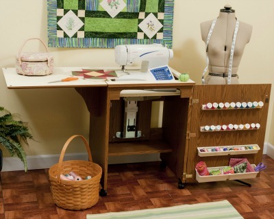 Sewing machine cabinets like this one, often fold up when they are not in use